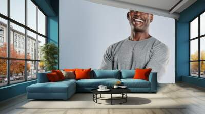 laughing african man in gray shirt with copy space Wall mural