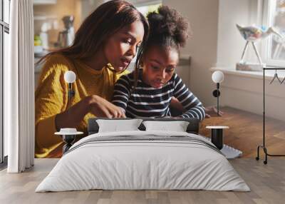 Little black girl learning to read Wall mural