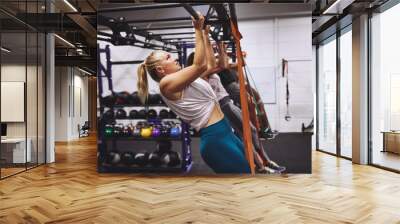 People working out with resistance bands at the gym Wall mural