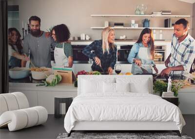 Six mixed Black and Caucasian friends cooking food Wall mural