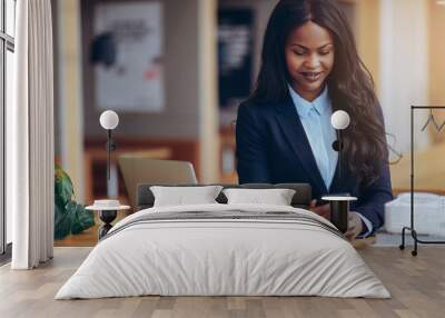 Smiling African American businesswoman reading a cellphone messa Wall mural