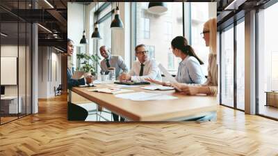 Smiling diverse businesspeople talking together around an office Wall mural