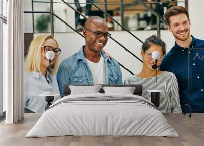 Smiling group of diverse businesspeople working together in an o Wall mural