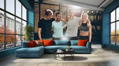 Smiling group of friends standing together after a gym workout Wall mural