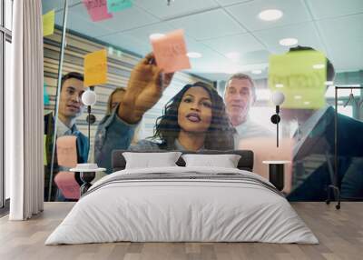 Woman showing business plan to the team Wall mural