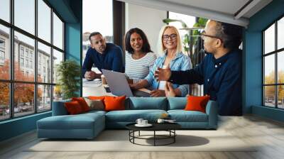 Young African American businessman discussing work with smiling Wall mural