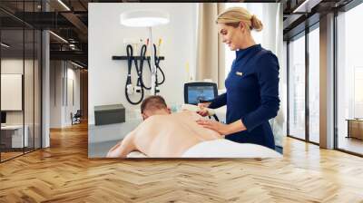 Young man getting an electrolysis treatment on his back Wall mural