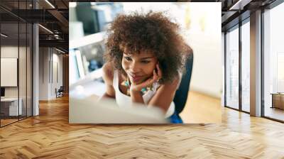 Young pretty woman working on pc Wall mural