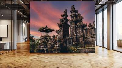 Magnific landscape view of besakih temple with fiery beautiful sky. Sacred balinese temple with traditional architecture Wall mural