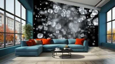 Explosion of water droplets into the camera in slow motion on an isolated black background. 3d illustration Wall mural