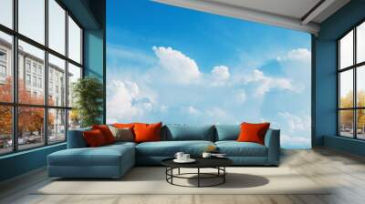 White fluffy cumulus clouds flying, fast moving blue sky at cloudy summer day Wall mural