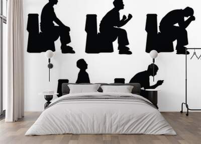 Set of young man sitting in the toilet bowl silhouette on white background Wall mural