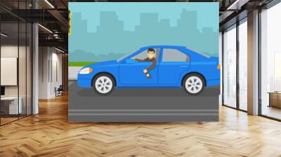 Drunk driver stopped at traffic signal. Happy male driver in a blue car holding a bottle. Young character leaning out of the car window. Side view. Flat vector illustration template. Wall mural