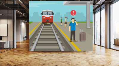 Young man waiting his train and calling the phone on platform while train is approaching. Railroad safety rules and tips. Flat vector illustration template.  Wall mural