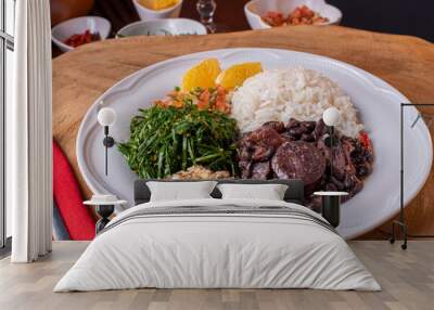 Typical Brazilian dish called Feijoada. Made with black beans, pork and sausage Wall mural