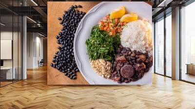 Typical Brazilian dish called Feijoada. Made with black beans, pork and sausage Wall mural