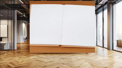 Blank open book with white page on warm background Wall mural