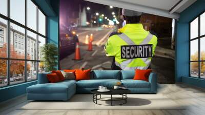 Security guard in car patroling at construction site at night  city Wall mural