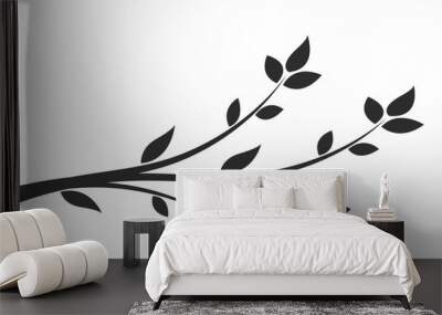 Silhouette of a branch with leaves. Young flowering tree. Sapling. Wall mural