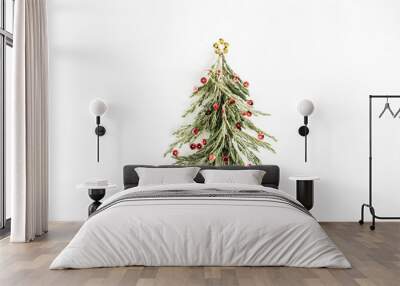 Christmas tree made of confetti and branch on white background. Flat lay, top view minimal holiday concept. Wall mural