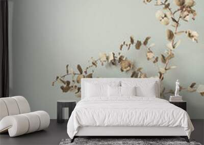 Dry eucalyptus branch in vase on pastel neutral background. Modern interior decoration design concept. Wall mural