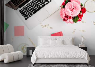 Flat lay home office desk. Female workspace with laptop, pink and red roses bouquet, golden accessories, red and mint diary on white background. Top view feminine background. Wall mural