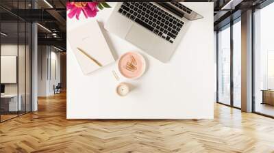 Home office desk workspace with laptop, pink peony flowers bouquet and notebook on white background. Flat lay, top view freelance work concept. Wall mural