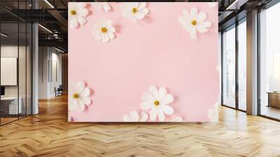 Minimal styled concept. White daisy chamomile flowers on pale pink background. Creative lifestyle, summer, spring concept. Copy space, flat lay, top view. Wall mural