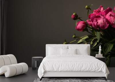 Pink peony flowers bouquet on black background. Minimalist elegant aesthetic floral composition Wall mural