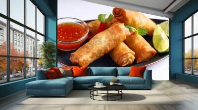 fried spring rolls with sweet chili sauce and lime on plate Wall mural