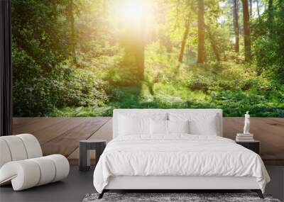 the picture of the wood table in the middle of the forest that surrounded with an uncountable amount of tree and plant in the forest with a bright light from the brightest sun of the daytime aigx03 Wall mural