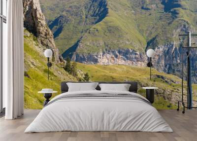 The Mountains around Gavarnie Gedre in the arid green countryside , Europe, France, Occitanie, Hautes-Pyrenees, in summer on a sunny day. Wall mural