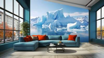 A Majestic Iceberg Surrounded by Ice Floes and a Glacier in the Background. The Sky is Clear and the Water is Reflecting the Light from the Sun. Wall mural