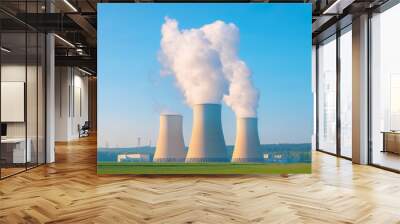 A nuclear power plant with large cooling towers emitting steam Wall mural