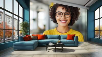 Portrait of a young Latina with short dark hair and glasses Wall mural