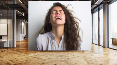 Screaming young woman against a white background Wall mural