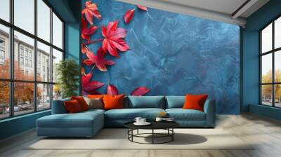 Autumn background with colored red leaves on blue slate background. Wall mural