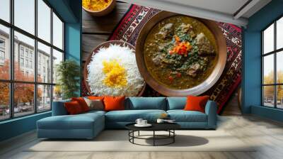 Iranian Ghormeh Sabzi, herb stew with beef, served with saffron rice on a Persian rug. Traditional Persian cuisine concept for design and print Wall mural