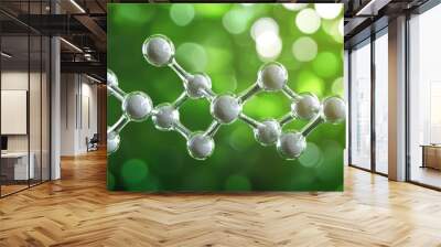 A molecule is shown in a green background with a blurry background Wall mural