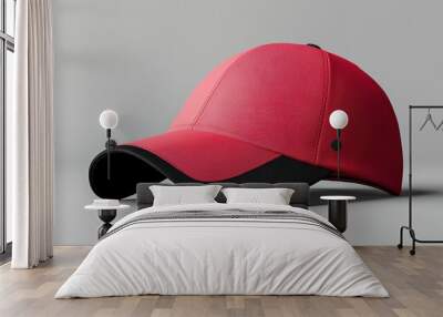 A red baseball cap with a black band Wall mural