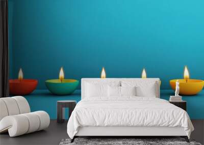 A row of colorful candles are lit up on a blue background Wall mural