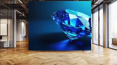 Glittering deep blue diamond gemstone with radiant facets on serene blue background Wall mural