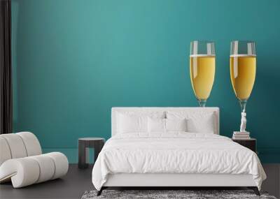 Two champagne glasses are on a blue background Wall mural