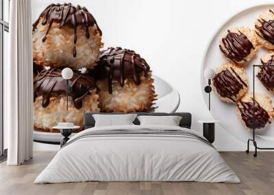 Bundle of coconut macaroons dipped in chocolate on plates isolated on white background, food collection Wall mural