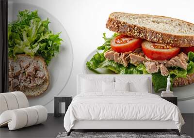 Tuna sandwich with fresh lettuce, tomato slices, and whole grain bread served on a white plate, ideal for a healthy lunch option, side and top view Wall mural