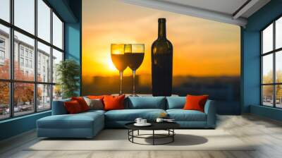 Silhouette female hand toasting wine on sunset background. Romantic couple celebrating at a restaurant Wall mural