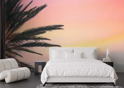 silhouette tropical palm tree with sun light on sunset sky. Copy space. Summer vacation and  travel concept. Wall mural