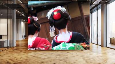 two geisha woman walking in the street Wall mural