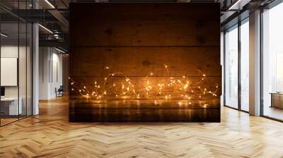 Golden bokeh lights on rustic wooden boards  -  Christmas and holidsy background texture with empty space -      Copy space for text  Wall mural