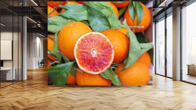 A bunch of oranges with one cut open. stockphoto. Wall mural